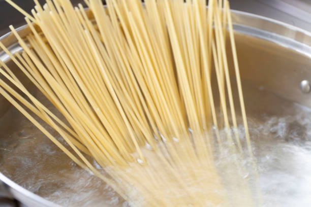 istock Boil spaghetti in a pan with boiling water 1157801182