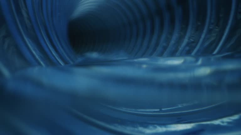 Slow motion of pipe tube inside view of water cleaning process of domestic and industrial waste sewers and organic pits with anti-limescale and degreasing products