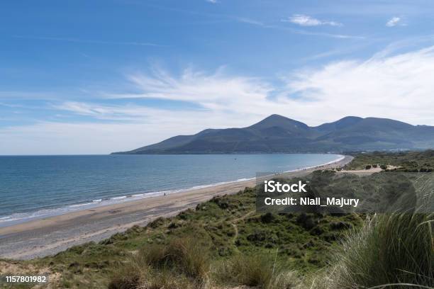 Coastal Dunes Beach Shoreline And Mountains Stock Photo - Download Image Now - Newcastle - County Down, Northern Ireland, Mourne Mountains