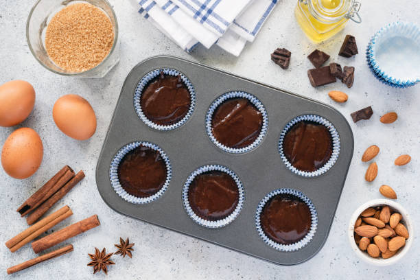istock Homemade cupcakes or muffins dough in baking tin 1157805034