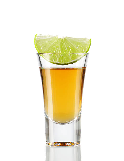 Tequila Tequila  shot with lime isolated on white tequila shot stock pictures, royalty-free photos & images