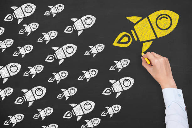 istock Leadership Concepts with Rockets on Chalkboard Background 1157806411