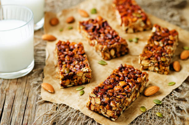 istock Honey nuts bars with glasses of milk 1157813505