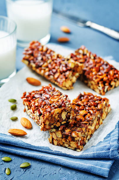 istock Honey nuts bars with glasses of milk 1157813583