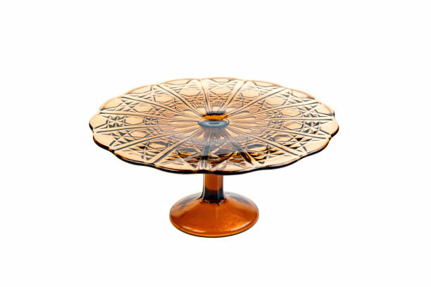 istock Glass cake stand in brown color isolated on white background. 1157813587