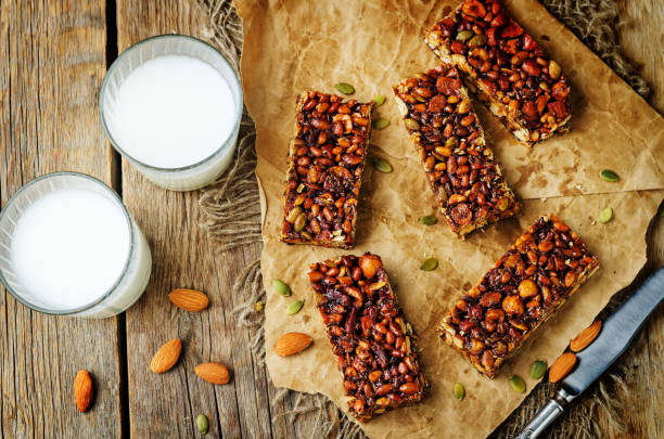 istock Honey nuts bars with glasses of milk 1157813592