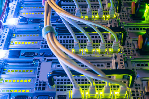 istock Powerful computer equipment of a modern data center is in the server room. High-speed internet connection. Many wires connect to the network interfaces of the router. 1157816722