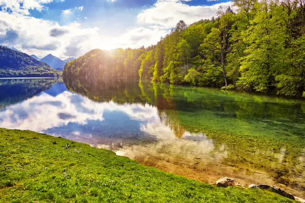 Photo of Majestic sunset at Hohenschwangau lake. Bavarian alps in Germany