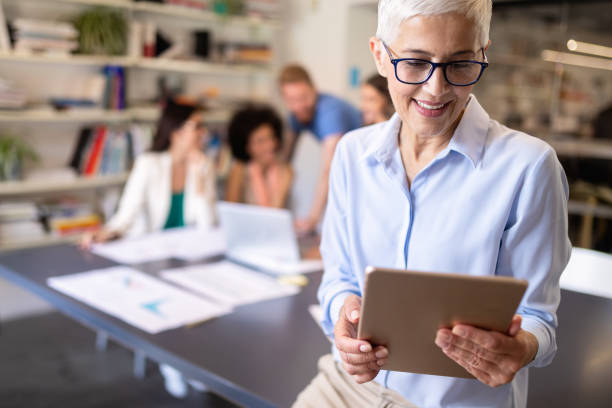 istock Group of successful business people at work in office 1157821427