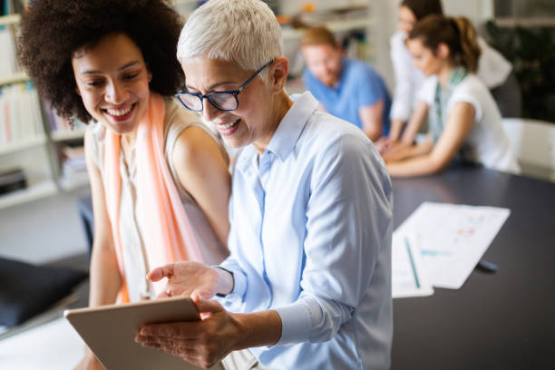 istock Successful group of business people at work in office 1157821445