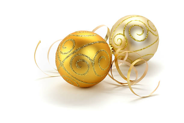 Gold and silver christmas baubles with ribbon isolated on white stock photo