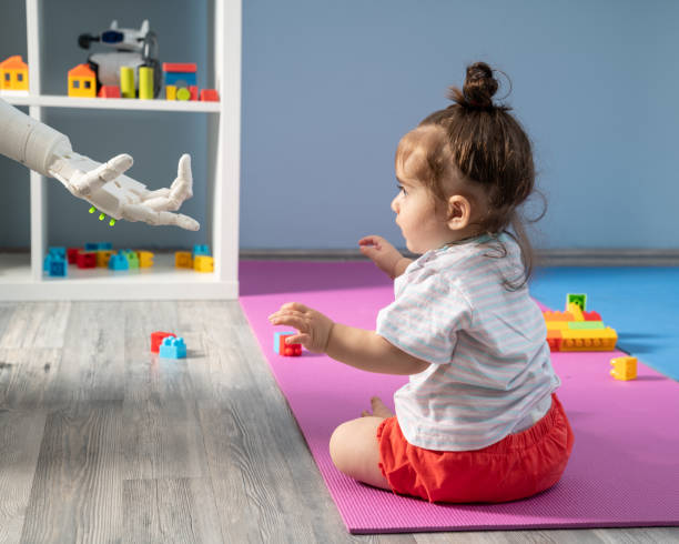 istock Baby Girl Playing With Robotics 1157824321