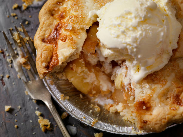 Individual Size Apple Pie with Vanilla Ice Cream Individual Size Apple Pie with Vanilla Ice Cream apple pie a la mode stock pictures, royalty-free photos & images
