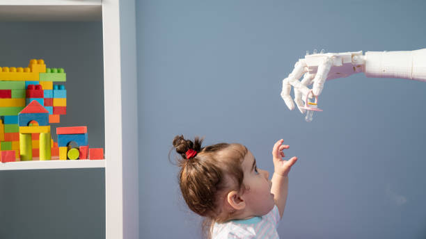 istock Humanoid Robotic Hand Giving Pacifier To Baby 1157826215
