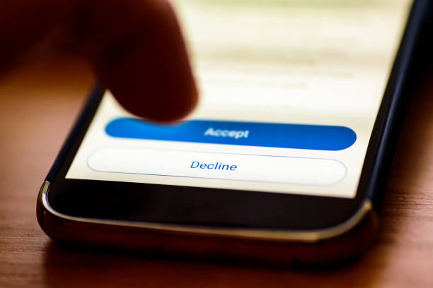 istock Decline button on smartphone screen closeup with human finger pointing to it 1157826257