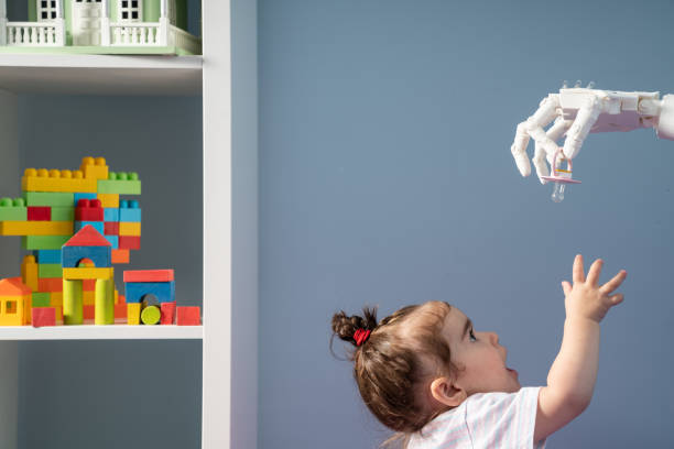 istock Humanoid Robotic Hand Giving Pacifier To Baby 1157826282