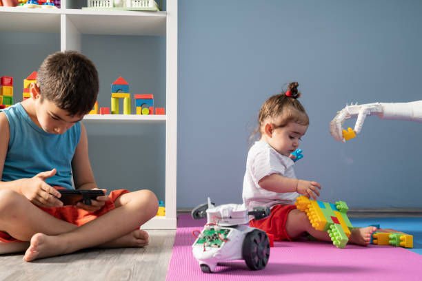 istock Baby Girl And Robot Playing With Toy Blocks 1157826607