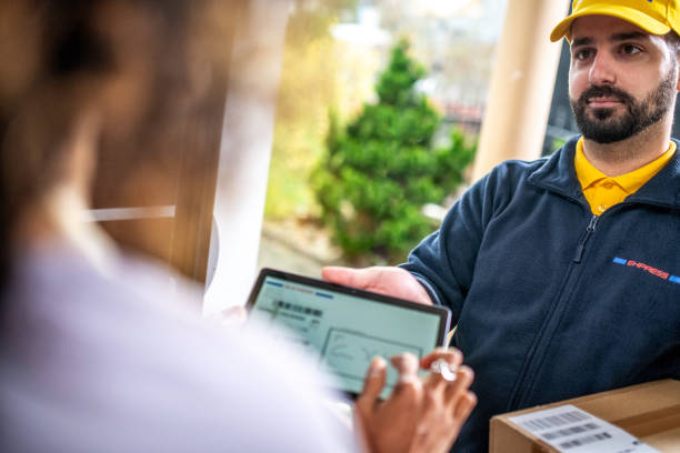 istock Customer signing home delivery 1157827504