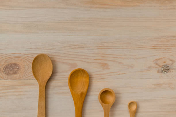 istock Empty wooden spoons on wooden background, copy space 1157827635