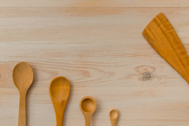 istock Empty wooden spoons on wooden background, copy space 1157827636
