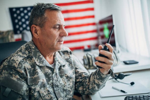 istock Senior soldier talking on walkie-talkie 1157827862