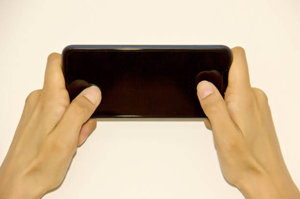 istock Female hand holding a cell phone 1157830389