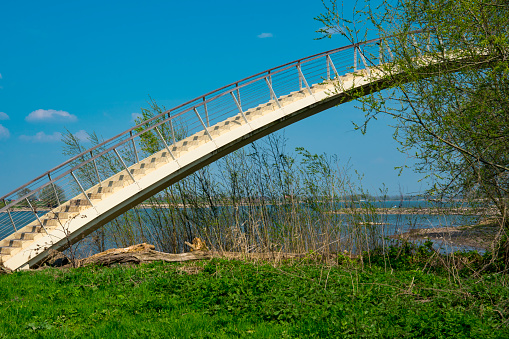 white bow bridge with stairs in park Gelderse Poort, Stadwaard. Nijmegen, Holland