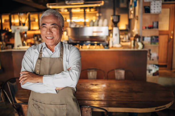 istock Senior cafe owner portrait 1157831446