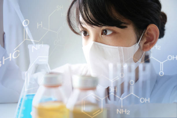 development of pharmaceutical products - scientist research test tube lab coat imagens e fotografias de stock