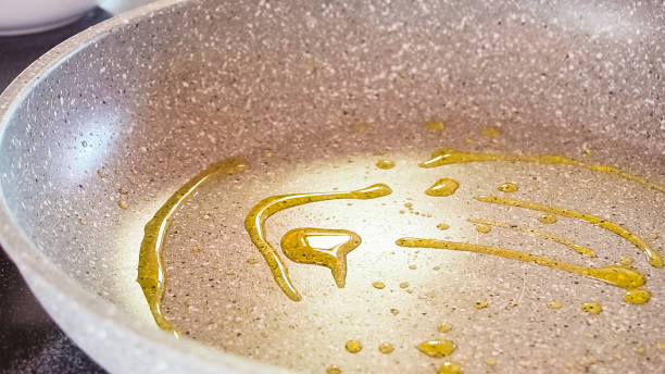 istock Frying organic egg in olive oil on frying pan. 1157837301