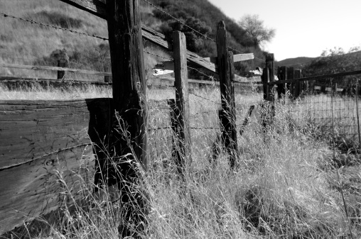 Wooden fence posts over 100 years old in rural central Montana in western USA of North America. Closest towns are 40 miles away.