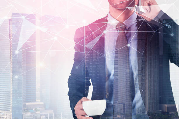 istock Businessman with coffee on phone, network 1157837439