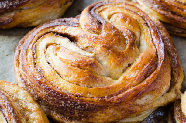 istock Baked fresh fragrant cinnamon buns. Traditional homemade pastries. 1157838271