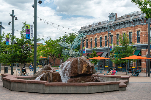 People relaxing in the quaint Old Town section of Fort Collins, Colorado.