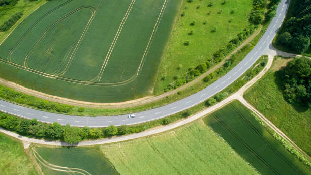 istock Road through agricultural fields - aerial view 1157840841