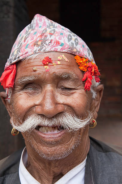 istock Old Nepali man with traditional hat 115784089