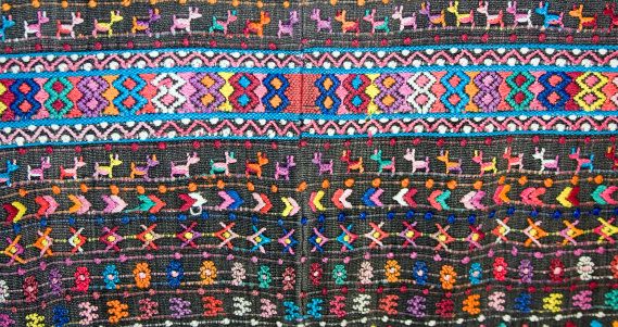 Handwoven on a traditional backstrap loom, the Huipil, cotton shirt, is the most important Mayan womens clothing item and an important part of Mayan identity.  The design varies from village to village. Most huipil designs are found in Guatemala some in southern Mexico. The fabric is made in two panels and is uneven.