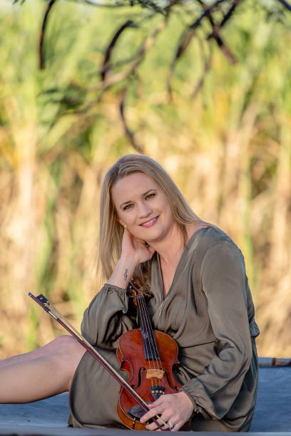 istock Beautiful Woman With Antique Violin 1157845371