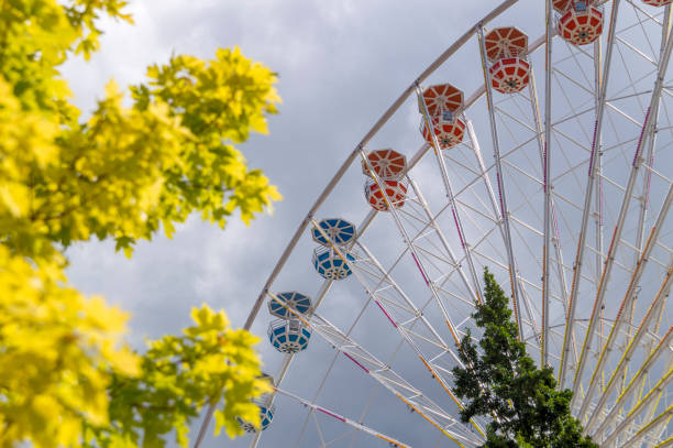 istock Tall Ferris Wheel Set Against a Moody Summer Sky 1157846553