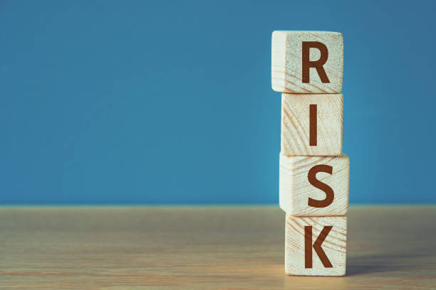 istock Risk word written on wooden cubes 1157853720