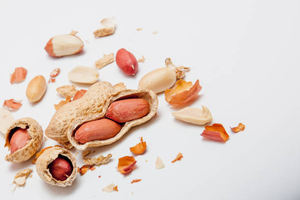 Dried peanut crushed close-up isolated on white background