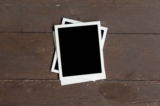 istock Photo frame on wood table background. Vintage concept. 1157853972