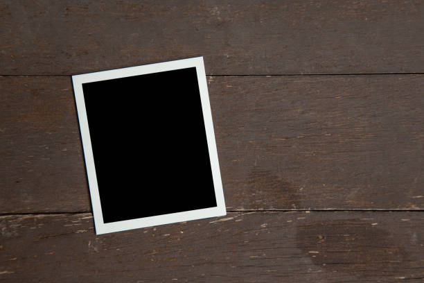 istock Photo frame on wood table background. Vintage concept. 1157854355