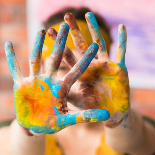 istock contemporary art performance hands colorful paint 1157859396