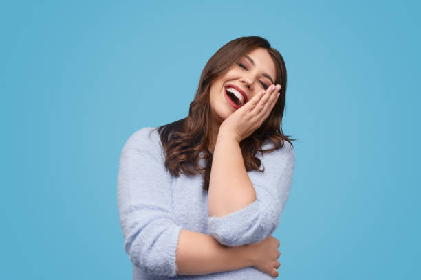 istock Delighted woman laughing at joke 1157859988