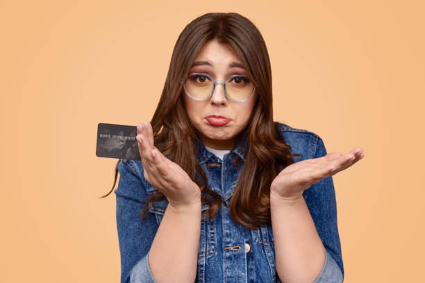 istock Upset female with negative balance on credit card 1157860014