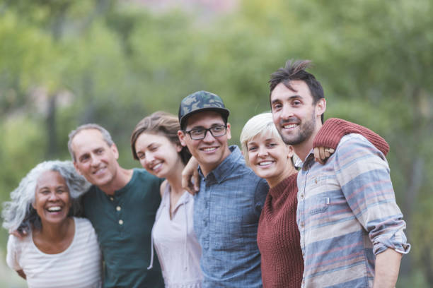 istock Multi-generational of friends posing together outside 1157863993