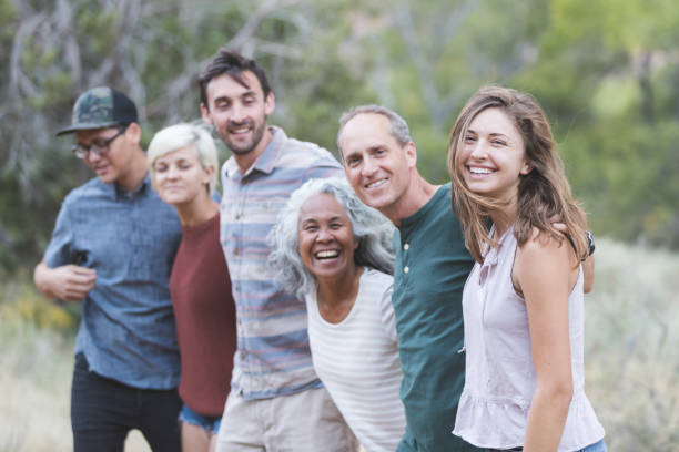 istock Multi-generational of friends posing together outside 1157863995