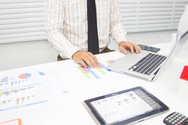 istock Businessmen are calculating and analyzing performance statistics for future investments. 1157873134