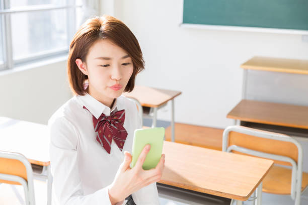 istock asian school girl, 1157873942